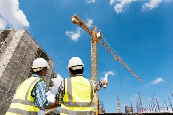 construction-engineers-discussion-with-architects-at-construction-site-or-building-site-of-highrise-building-700-158701387